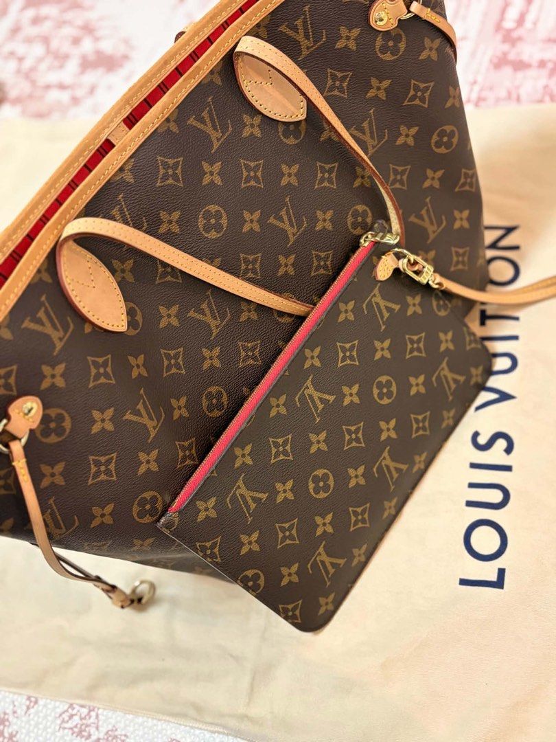 Louis Vuitton Monogram Neverfull MM Tote Bag (Category: Luxury Bags & Wallets) located in Manila. Submitted by dianaalcar03441 (Listing ID 1470260414, Image 2). Description: Monogram canvas exterior with vachetta leather trim. Classic red and black striped textile lining inside. Zippered pocket and matching removable pouch included. Gold-tone hardware throughout. Generous interior space with structured base. Dust bag included. Bought Last 2023.