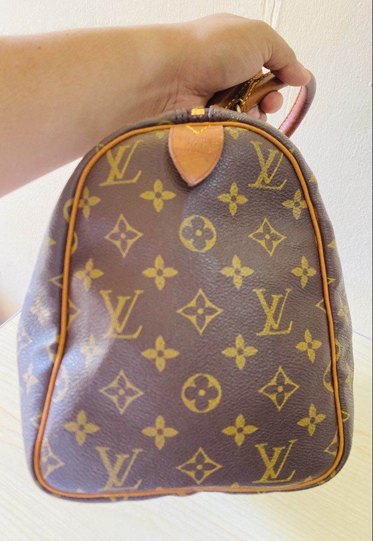Louis Vuitton Monogram Speedy Handbag (Category: Luxury Bags & Wallets) located in Manila. Submitted by junejanuary (Listing ID 1470192339, Image 3). Description: - authentic monogram canvas pattern - Brown leather handles with gold-tone hardware - Secure zip top closure with leather pull tab - Structured doctor bag silhouette with spacious interior - Condition: Natural patina and typical darkening on leather handles from handling.