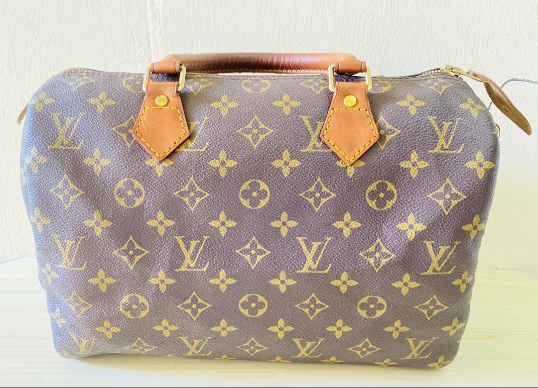 Louis Vuitton Monogram Speedy Handbag (Category: Luxury Bags & Wallets) located in Manila. Submitted by junejanuary (Listing ID 1470192339, Image 1). Description: - authentic monogram canvas pattern - Brown leather handles with gold-tone hardware - Secure zip top closure with leather pull tab - Structured doctor bag silhouette with spacious interior - Condition: Natural patina and typical darkening on leather handles from handling.