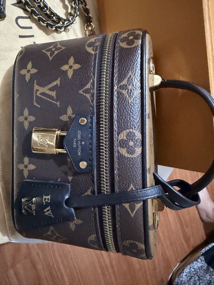 Louis Vuitton Monogram Vanity PM Handbag (Category: Luxury Bags & Wallets) located in Manila. Submitted by arcietan02437 (Listing ID 1470258038, Image 3). Description: - Brand: Louis Vuitton - Style: Monogram Vanity Bag - Color: Dark Brown - Hardware: Gold-tone - Features: Top handle, padlock, and key bell (stamped with initials E.W.) - Straps: Includes detachable leather strap and chain strap - Inclusions: Original box, dust bag, and tag - Condi