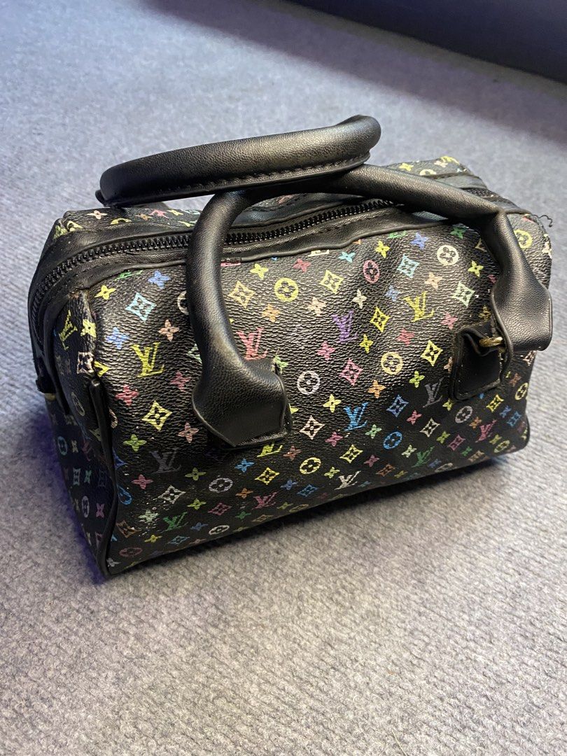 Louis Vuitton Multicolor Monogram Speedy Handbag (Category: Luxury Bags & Wallets) located in Maria Aurora. Submitted by mightypenguin.f7ca53 (Listing ID 1470147041, Image 2). Description: - Style: Compact everyday barrel bag - Material: Black multicolour monogram canvas with black leather dual top handles - Hardware: Gold-tone hardware throughout with a secure zip top closure - Condition: Minor loose thread near the zipper pull and light wear ar