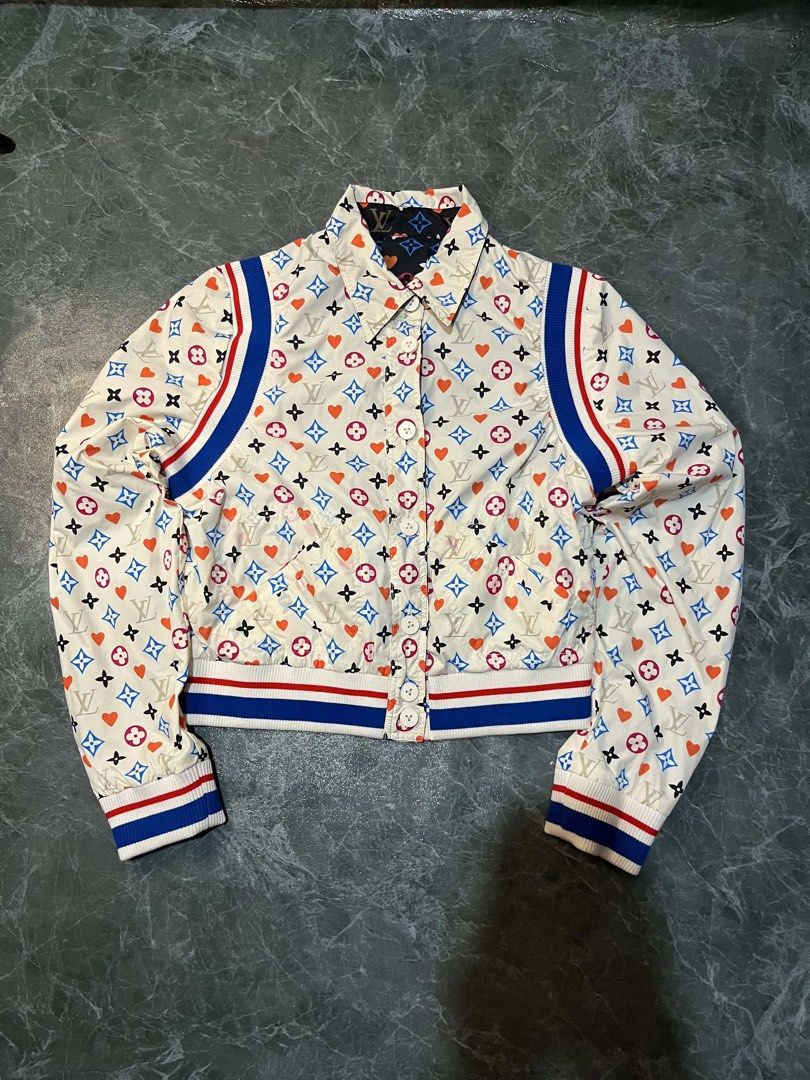 Louis Vuitton Reversible Monogram Heart Bomber Jacket Size 38 (Category: Coats, Jackets and Outerwear) located in Valencia. Submitted by thriftyfinds01 (Listing ID 1470297453, Image 2). Description: - Brand: Louis Vuitton - Style: Reversible Bomber Jacket - Condition: Excellent - Size: 38 (Made in Italy) - Design Side 1: Black fabric with multicolored monogram and heart print - Design Side 2: Cream-colored with matching monogram and heart print -