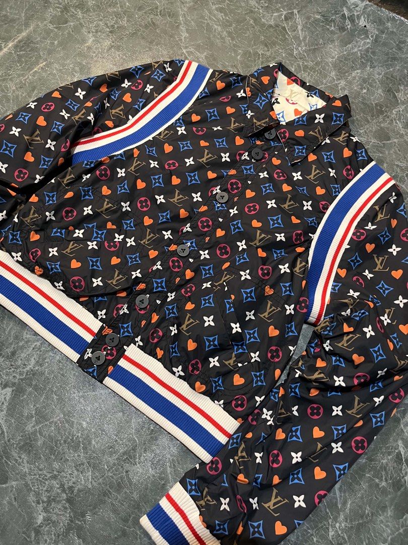 Louis Vuitton Reversible Monogram Heart Bomber Jacket Size 38 (Category: Coats, Jackets and Outerwear) located in Valencia. Submitted by thriftyfinds01 (Listing ID 1470297453, Image 3). Description: - Brand: Louis Vuitton - Style: Reversible Bomber Jacket - Condition: Excellent - Size: 38 (Made in Italy) - Design Side 1: Black fabric with multicolored monogram and heart print - Design Side 2: Cream-colored with matching monogram and heart print -