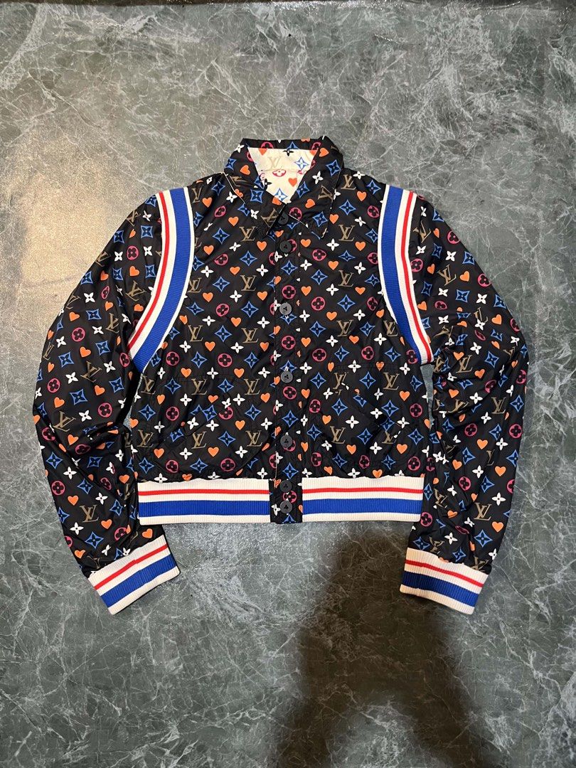 Louis Vuitton Reversible Monogram Heart Bomber Jacket Size 38 (Category: Coats, Jackets and Outerwear) located in Valencia. Submitted by thriftyfinds01 (Listing ID 1470297453, Image 1). Description: - Brand: Louis Vuitton - Style: Reversible Bomber Jacket - Condition: Excellent - Size: 38 (Made in Italy) - Design Side 1: Black fabric with multicolored monogram and heart print - Design Side 2: Cream-colored with matching monogram and heart print -