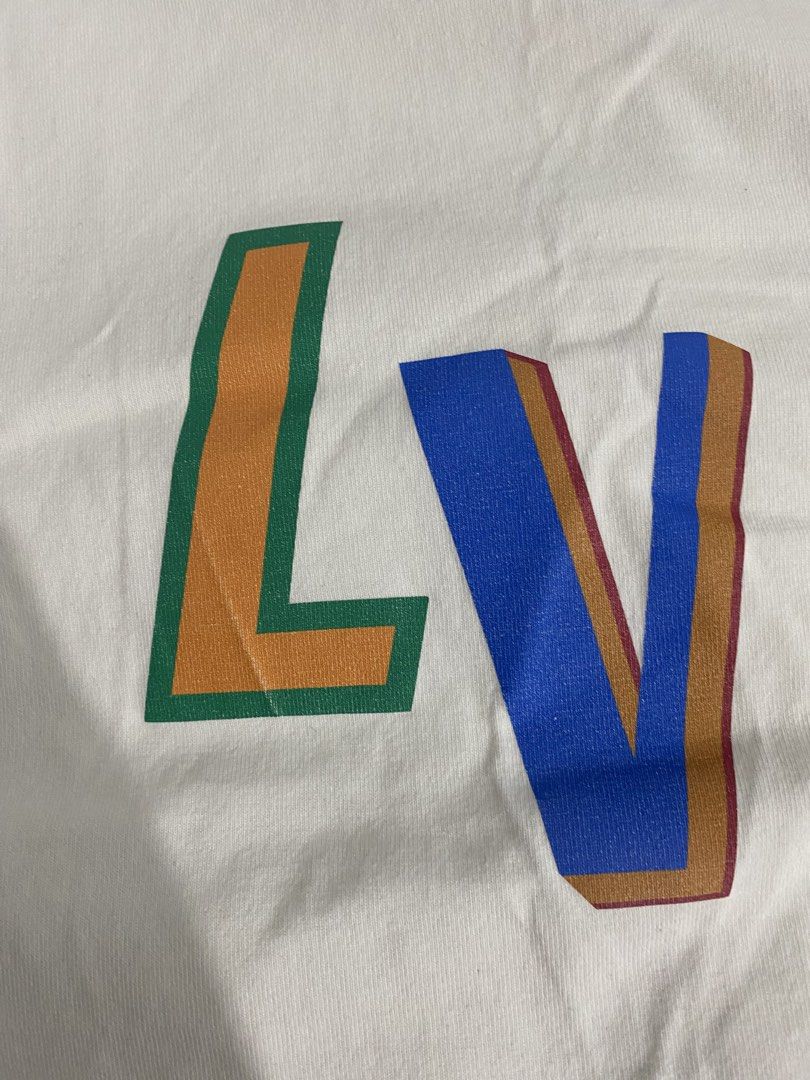 Louis Vuitton x NBA Logo White Tee (Category: Tshirts & Polo Shirts ) located in Manila. Submitted by annroque26 (Listing ID 1470289906, Image 2). Description: Send me a personal message for offers - Authentic Louis Vuitton x NBA collaboration t-shirt - Crisp white cotton fabric with standard crew neck - Colorful embroidered LV letters on the chest - Official stitched NBA patch near the bottom hem - Style Code: RM212M DT3 HLY20W | CA 36929 - Clea