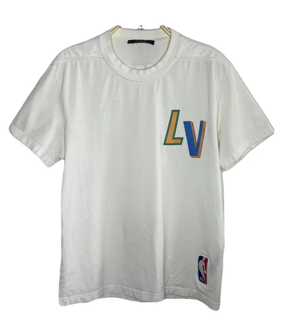 Louis Vuitton x NBA Logo White Tee (Category: Tshirts & Polo Shirts ) located in Manila. Submitted by annroque26 (Listing ID 1470289906, Image 1). Description: Send me a personal message for offers - Authentic Louis Vuitton x NBA collaboration t-shirt - Crisp white cotton fabric with standard crew neck - Colorful embroidered LV letters on the chest - Official stitched NBA patch near the bottom hem - Style Code: RM212M DT3 HLY20W | CA 36929 - Clea
