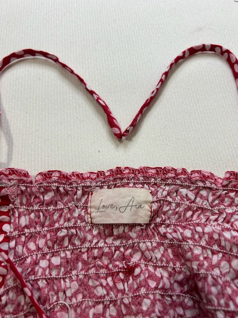 Love, Ara Red Cropped Top (Category: Sleeveless) located in Quezon City. Submitted by bdmc.clothing (Listing ID 1470252589, Image 2). Description: Brand: Love, Ara Type of Clothing: Blouse Size on tag: Extra Small Issues: loose stitching on the right strap Condition: Like New Fabric: 100% Cotton Price: 250.