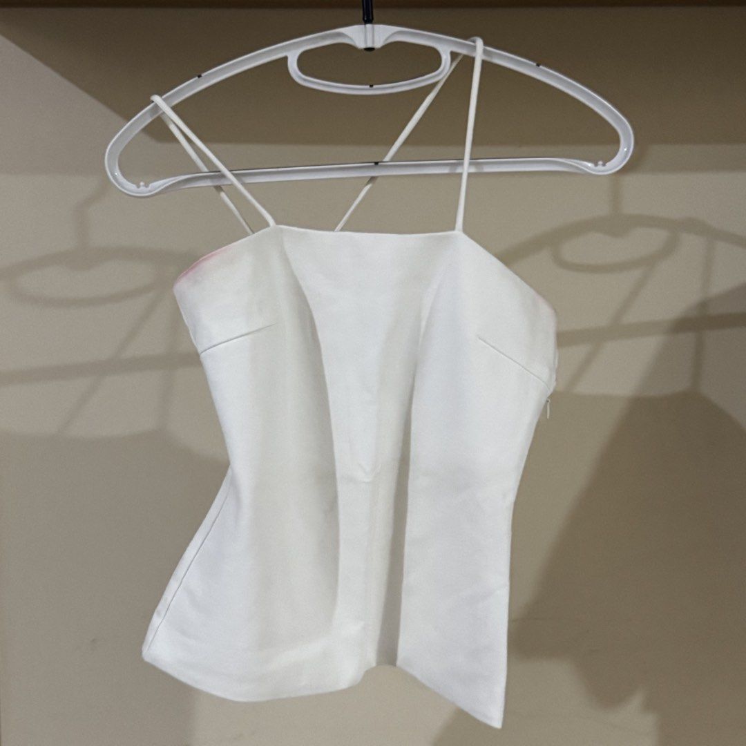 Love Bonito Two Stringed Top (Category: Sleeveless) located in Mandaluyong City. Submitted by cloudycloset09 (Listing ID 1470263646, Image 3). Description: Original Love Bonito top I bought from online back then. Used only 2x. Decluttering now because it is already tight on me + it has reddish stains that didn’t go away during laundry. I haven’t had the stains professionally removed them though so there might be hope? Can fit XS to S frame.