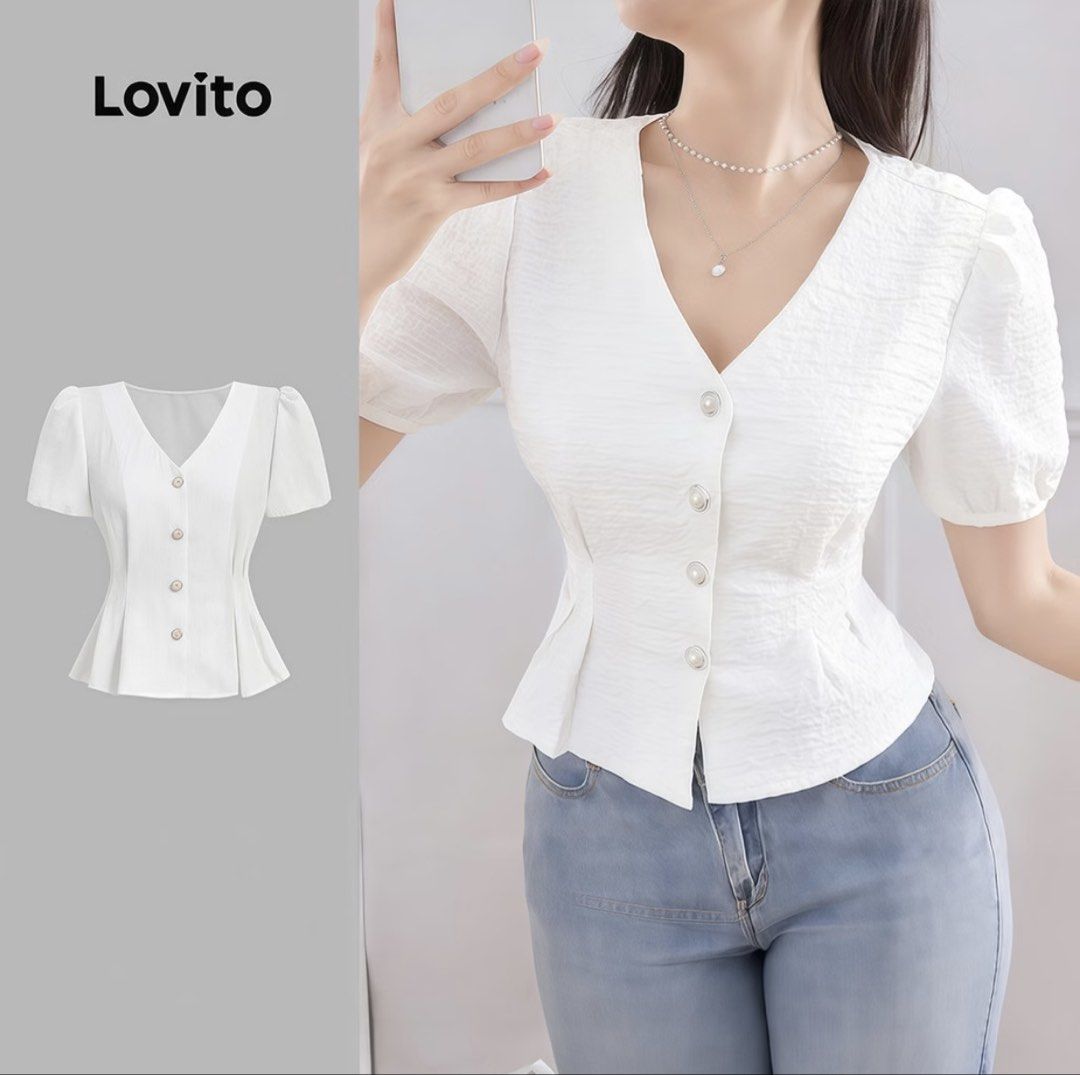 Lovito White Blouse (Category: Blouses) located in Makati City. Submitted by marymontalve (Listing ID 1470300145, Image 2). Description: - Brand: Lovito - Color: Classic White - Style: Peplum blouse with short puff sleeves and V-neckline - Details: Chic row of pearl-style buttons and textured vertical fabric - Fit: Fitted waist that flares out slightly at the hem - Pairing: Great with light wash jeans or skirts for a casual day out - Condition: B