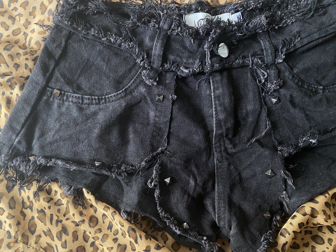 low rise black distressed denim shorts, asymmetrical hems and subtle stud (Category: Shorts) located in Manila. Submitted by lavernsloop (Listing ID 1470074929, Image 2). Description: size 25| low lenght 10 📩DM FOR MORE DEETS!.