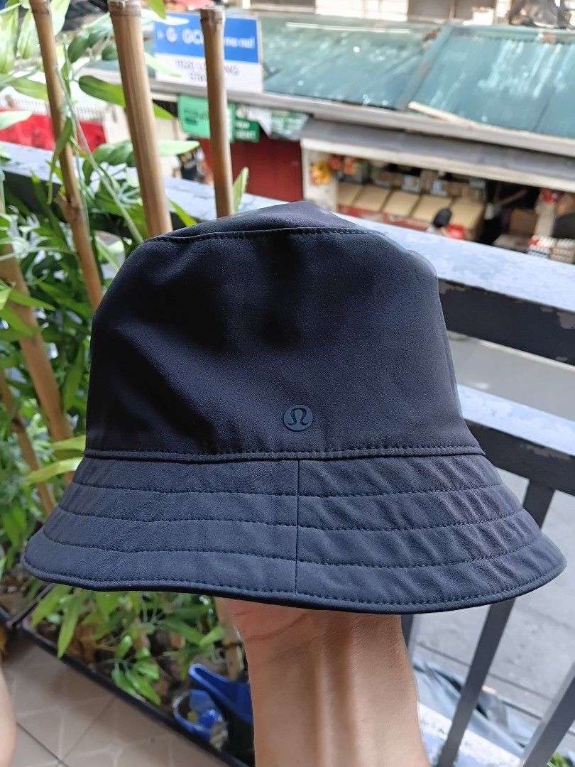 Lululemon Black Camo Bucket Hat (Category: Caps & Hats) located in Manila. Submitted by grandflower-547aee (Listing ID 1470242419, Image 2). Description: - Brand: Lululemon - Color: Black Camouflage - Design: Stitched brim with signature side logo - Material: Lightweight and easy to pack - Best for: Running, outdoor workouts, and casual daily wear - Condition: Excellent / Like new - Meetup or shipping options available across PH.