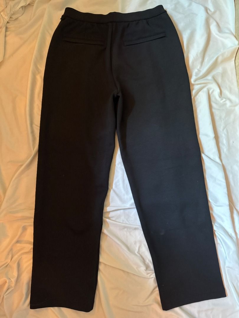 Lululemon Black Trouserss Size M (Category: Trousers) located in Cebu City. Submitted by _t.rix (Listing ID 1470166346, Image 3). Description: - Brand: Lululemon - Size: M (label attached) - Fit: Elastic waistband with a comfy pull-on design - Style: Structured front creases and sleek silhouette - Pockets: Two welt pockets on the back - Material: Smooth, stretchy fabric - Versatility: Perfect for both casual outings and dressy occasions.