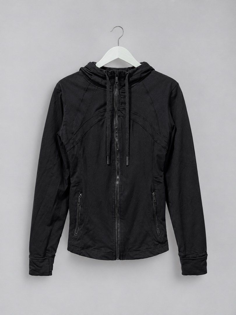 Lululemon Black Zip-Up Hoodie Size 6 (Category: Coats, Jackets and Outerwear) located in Iloilo. Submitted by cloud.thrifts (Listing ID 1470157244, Image 1). Description: - Brand: Lululemon - Color: Classic Black - Size: AU/US 6 - Design: Full-front zip, matching drawstring hood, and signature seam details - Pockets: Secure zippered hand pockets on both sides - Material: Breathable nylon and lycra blend - Details: Iconic logo emblem on back colla