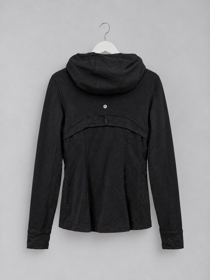 Lululemon Black Zip-Up Hoodie Size 6 (Category: Coats, Jackets and Outerwear) located in Iloilo. Submitted by cloud.thrifts (Listing ID 1470157244, Image 2). Description: - Brand: Lululemon - Color: Classic Black - Size: AU/US 6 - Design: Full-front zip, matching drawstring hood, and signature seam details - Pockets: Secure zippered hand pockets on both sides - Material: Breathable nylon and lycra blend - Details: Iconic logo emblem on back colla