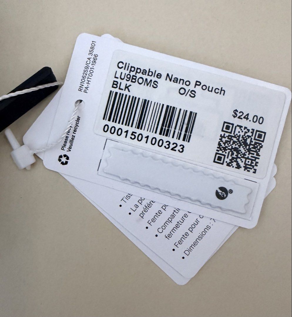 Lululemon Clippable Nano Pouch Black (Category: Purses & Pouches) located in Pasig City. Submitted by jrrhs (Listing ID 1470203349, Image 2). Description: - Brand new with original store tags - Color: Classic Black - Ideal for holding cards, hand sanitizer, or lip balm - Smooth zipper closure with silver-tone logo pull - Features interior Lululemon wordmark print - Convenient clip easily attaches to backpacks or larger bags.