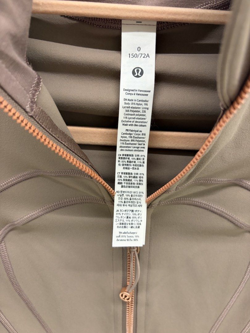 Lululemon Define Jacket Rose Gold Size 0 (Category: Coats, Jackets and Outerwear) located in Manila. Submitted by genyfurrose (Listing ID 1470157696, Image 3). Description: - Brand: Lululemon - Style: Define Jacket - Color: Brownish Taupe with Rose Gold hardware & zippers - Size: 0 (150/72A) - Material: Nylon and Lycra elastane blend (Made in Cambodia) - Features: Thumbholes, zippered front pockets, structured paneled stitching - Condition: Clean