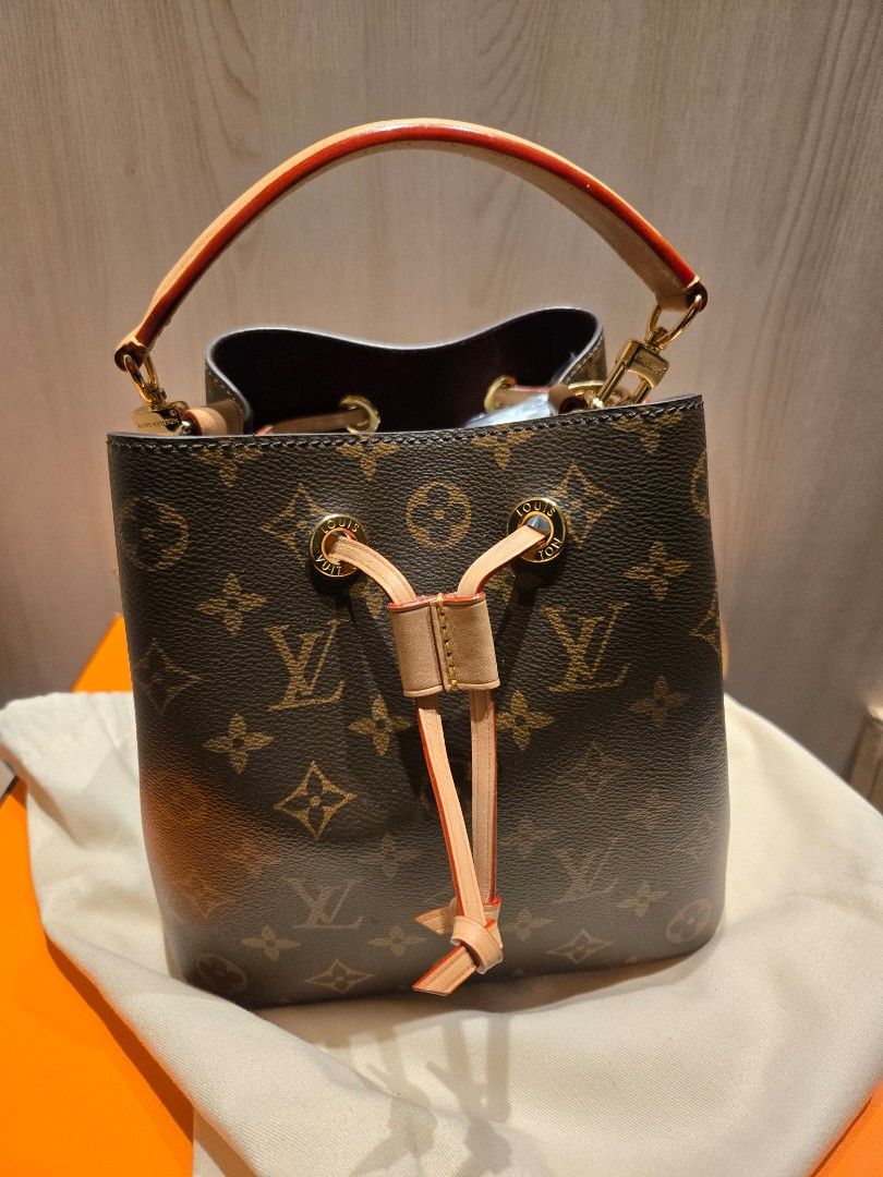 Louis Vuitton NeoNoe BB Monogram (Category: Luxury Bags & Wallets) located in Manila. Submitted by luxtimeless (Listing ID 1470265211, Image 1). Description: - Authentic Louis Vuitton NeoNoe bucket bag - Iconic brown monogram coated canvas with natural cowhide leather trim - Luxurious burgundy microfiber interior lining - Secure drawstring top closure with shiny gold-tone hardware - Stamped Louis Vuitton Paris, Made in France - Clean overall cond
