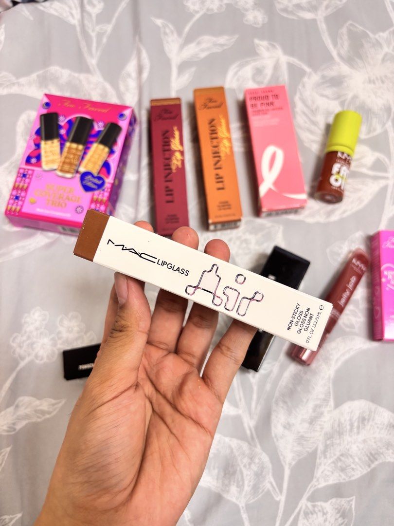 MAC Lipglass Lip Gloss 225 Instinct (Category: Makeup) located in Bulacan. Submitted by ttttopme (Listing ID 1470319544, Image 2). Description: - Brand: MAC - Product: Lipglass - Shade: 225 Instinct (neutral brown nude) - Finish: High shine, non-sticky formula - Size: Standard 0.17 oz - Condition: Unused, opened only for shade check and photos - Packaging: Comes with original box.