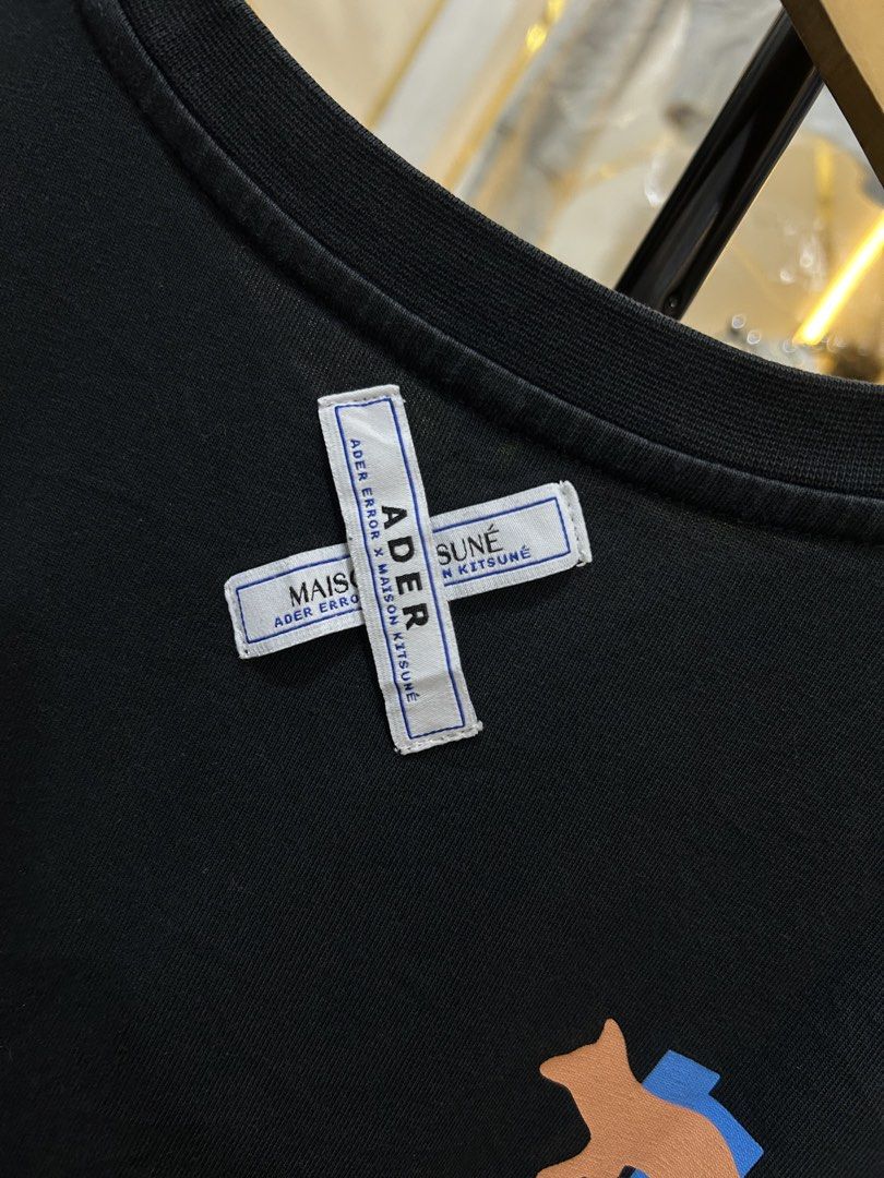 Maison Kitsuné x Ader Error Tee(Collab (Category: Tshirts & Polo Shirts ) located in Manila. Submitted by cachegoodsuncovers (Listing ID 1470342115, Image 2). Description: ✅Size:M-L ✅️DIMES: - W22 x L29 ✅️CONDITION - Exellent ✅Crew neck ✅️COLOR RATE - 9/10 ✅️Complete tags ✅️Color may vary due to lighting ✅️ISSUE -❌ .