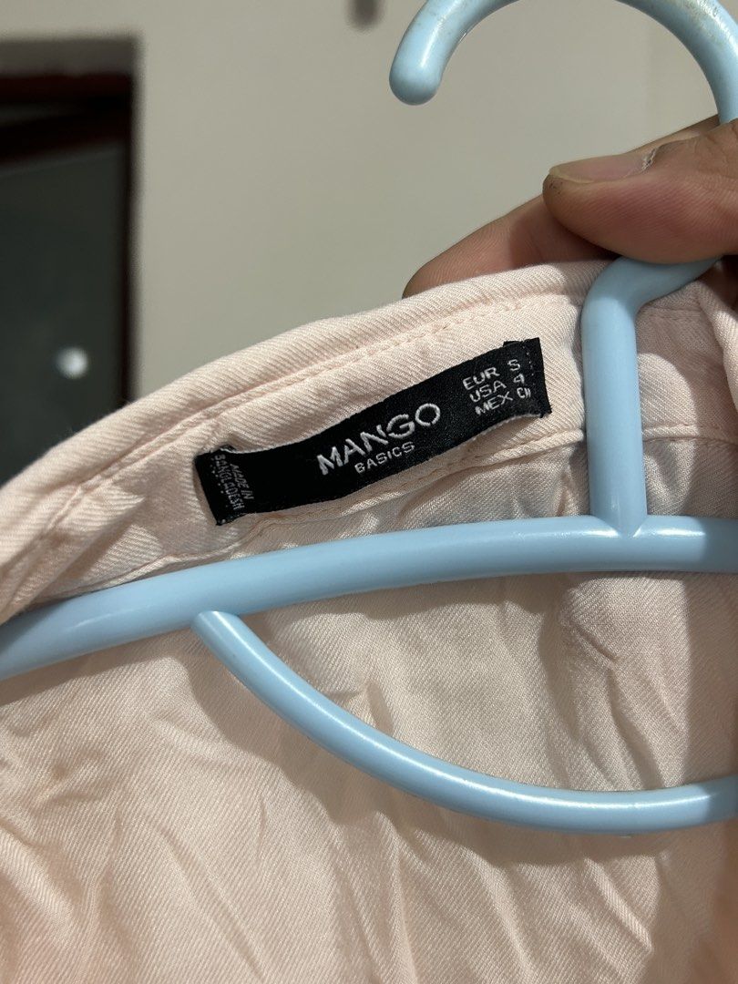 Mango Basics Light Pink Button-Down Long Sleeve Shirt Size S (Category: Longsleeves) located in Pasig City. Submitted by eddwuhrd (Listing ID 1470167404, Image 2). Description: - Brand: Mango - Style: Long sleeve button-down shirt with dual chest flap pockets - Color: Light Pink - Size: EUR S / USA 4 - Fabric: Lightweight, perfect for layering or wearing on its own - Measurements: Length 22" | Width 17" - Condition: Great casual everyday piece.