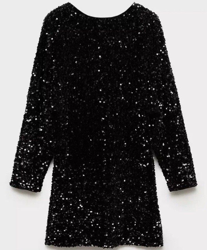 Mango Black Sequin Mini Dress (Category: Dresses) located in Makati City. Submitted by mkdmaniego (Listing ID 1470225623, Image 3). Description: - Brand: Mango - Style: Black sequin mini dress with long sleeves and boat neckline - Details: Fully covered in sparkly black sequins, button closure at the back neck - Condition: Worn once, great shape with zero missing sequins - Fit: True to size, perfect for parties and night outs Fabric with sequin. 