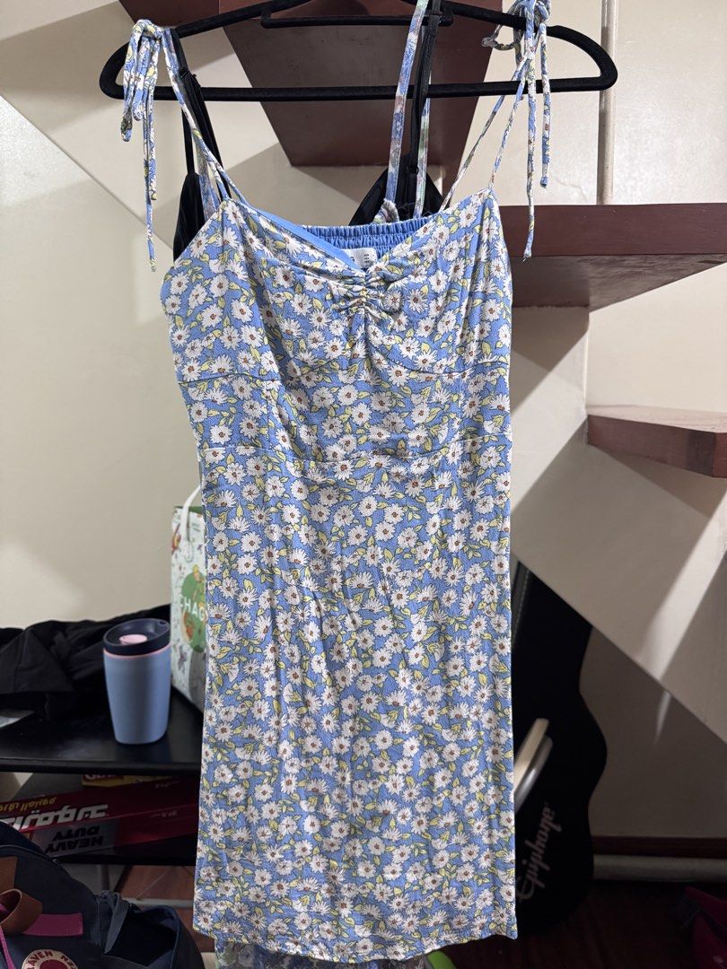 Mango blue floral summer dress (Category: Dresses) located in Quezon City. Submitted by peanutsquash (Listing ID 1470217695, Image 1). Description: - Color/Pattern: Blue with all-over white and yellow daisy print - Design: Spaghetti straps with tie shoulders, sweetheart neckline with center ruching - Fabric: Lightweight and breathable, ideal for warm weather - Style: Casual mini dress, easy to pair with sneakers or sandals - Condition: lightly us