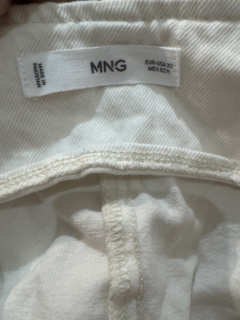 Mango Cream Denim Vest (Category: Sleeveless) located in Makati City. Submitted by banshee1411 (Listing ID 1470239044, Image 2). Description: - Brand: MNG - Size: XS - Color: Cream / Neutral - Material: Structured denim - Closure: Front button with metal hardware - Fit: Tailored with a pointed hemline.