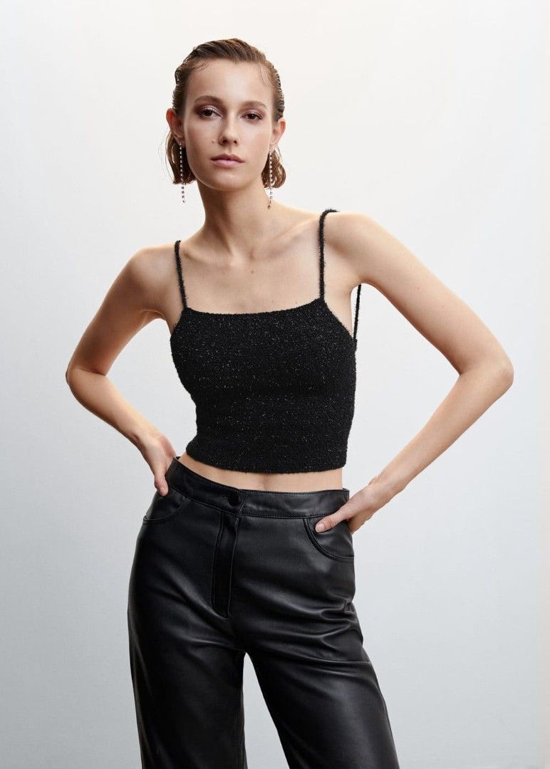 Mango Crossback Sparkly Knit Crop Top with Lace-Up Back (Category: Sleeveless) located in Taguig. Submitted by ashie_clothing (Listing ID 1470319505, Image 2). Description: - Style: Sparkly black knit crop top - Design: Straight neckline, thin straps, and unique lace-up back with bottom tie - Texture: Soft and fuzzy with a subtle metallic shimmer - Occasion: Ideal for parties, clubs, and nights out - Sizing: Standard PH sizing.