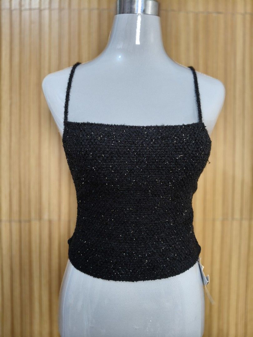 Mango Crossback Sparkly Knit Crop Top with Lace-Up Back (Category: Sleeveless) located in Taguig. Submitted by ashie_clothing (Listing ID 1470319505, Image 3). Description: - Style: Sparkly black knit crop top - Design: Straight neckline, thin straps, and unique lace-up back with bottom tie - Texture: Soft and fuzzy with a subtle metallic shimmer - Occasion: Ideal for parties, clubs, and nights out - Sizing: Standard PH sizing.