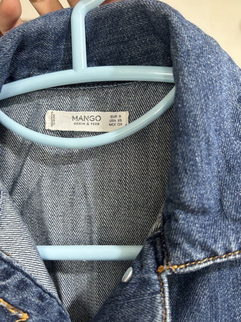 Mango Denim & Tees Blue Denim Dress (Category: Dresses) located in Pasig City. Submitted by eddwuhrd (Listing ID 1470167629, Image 3). Description: - Brand: Mango Denim & Tees - Style: Blue denim shirt dress with short sleeves, button placket, and chest pocket - Size: Tagged EUR S / USA XS - Measurements: Waist approx. 30-34 inches (flat), Length approx. 36 inches - Condition/Material: Good fabric weight, perfect for casual everyday wear.