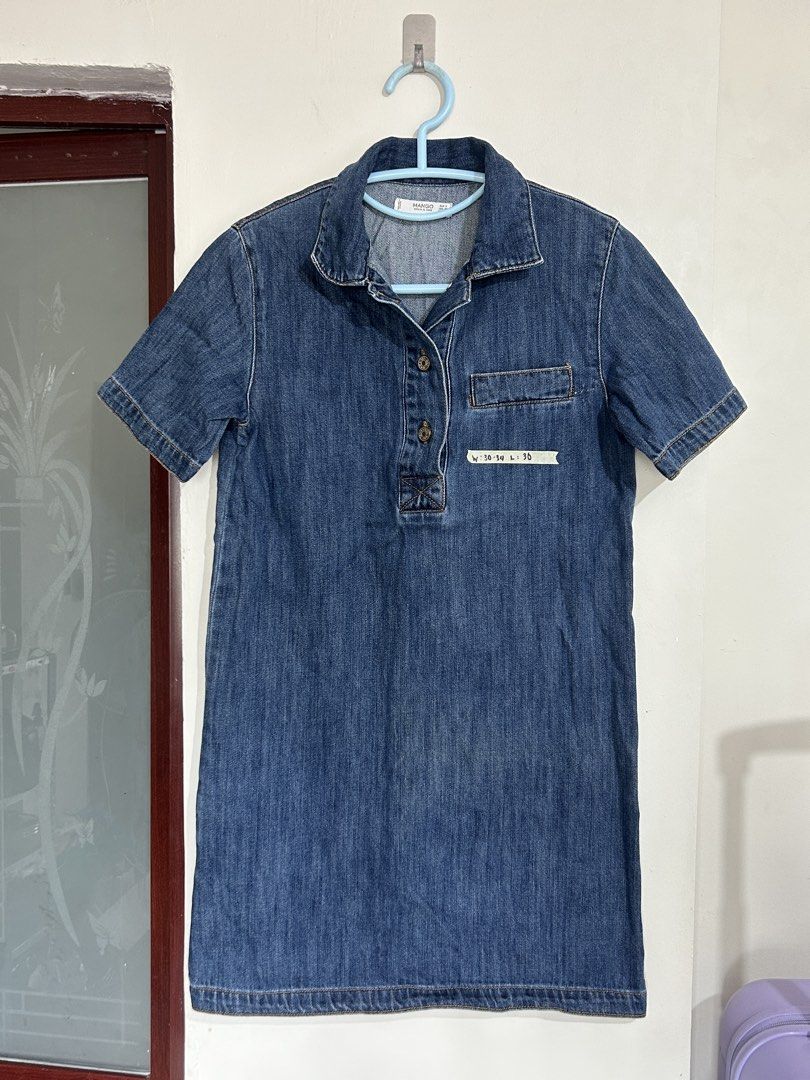 Mango Denim & Tees Blue Denim Dress (Category: Dresses) located in Pasig City. Submitted by eddwuhrd (Listing ID 1470167629, Image 1). Description: - Brand: Mango Denim & Tees - Style: Blue denim shirt dress with short sleeves, button placket, and chest pocket - Size: Tagged EUR S / USA XS - Measurements: Waist approx. 30-34 inches (flat), Length approx. 36 inches - Condition/Material: Good fabric weight, perfect for casual everyday wear.