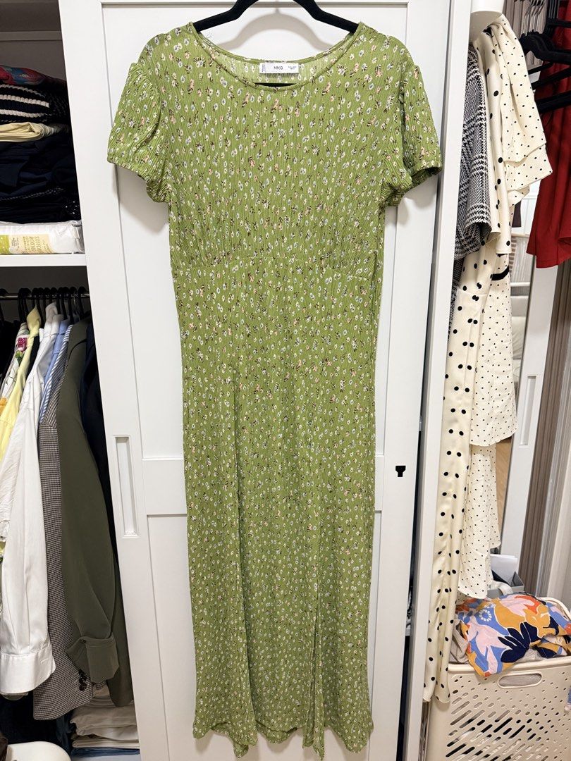 Mango Green Floral Midi Dress (Category: Dresses) located in Manila. Submitted by .yansells (Listing ID 1470336479, Image 1). Description: - Brand/Style: Mango green midi dress with a dainty white and pink floral print - Details: Round neckline, short sleeves with slight gathering, and a chic high side slit - Fabric: Lightweight, textured crinkle finish that doesn't cling - Condition: Worn once for a wedding, freshly washed, and carefully stored.