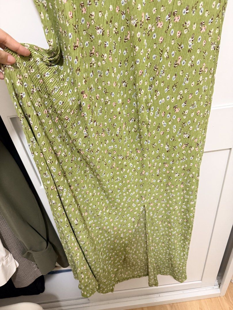 Mango Green Floral Midi Dress (Category: Dresses) located in Manila. Submitted by .yansells (Listing ID 1470336479, Image 3). Description: - Brand/Style: Mango green midi dress with a dainty white and pink floral print - Details: Round neckline, short sleeves with slight gathering, and a chic high side slit - Fabric: Lightweight, textured crinkle finish that doesn't cling - Condition: Worn once for a wedding, freshly washed, and carefully stored.