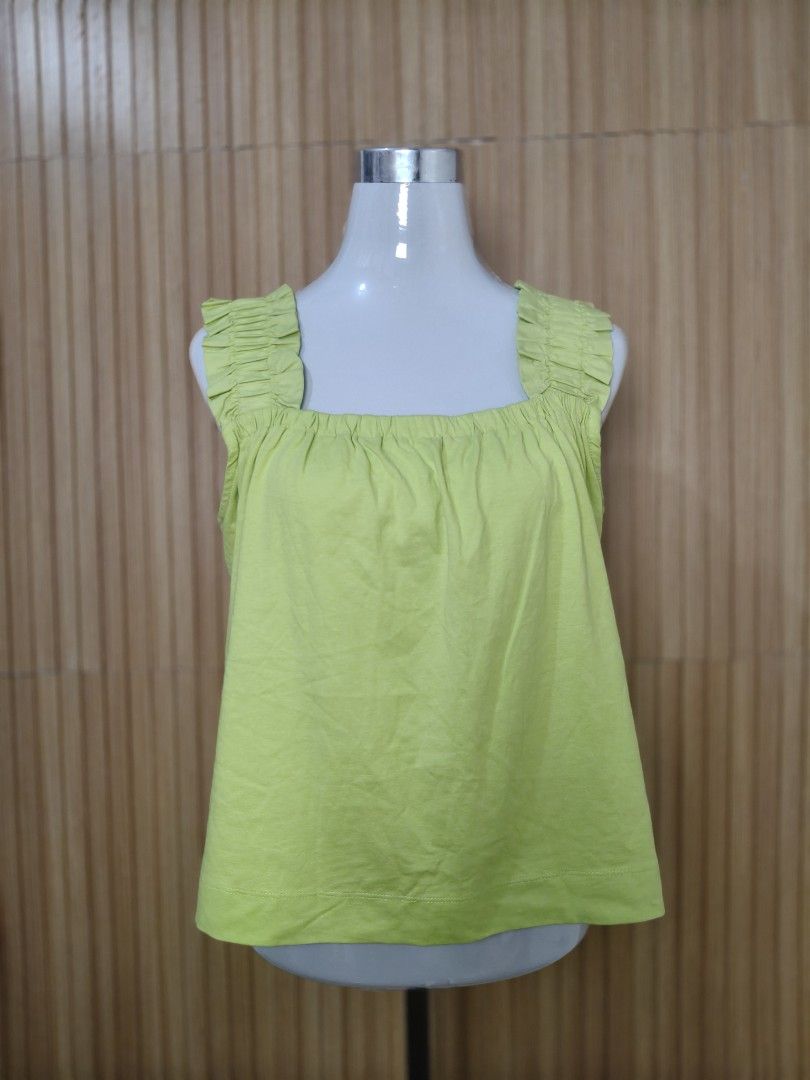 Mango Lime Green Ruffled Strap Tank Top (Category: Sleeveless) located in Taguig. Submitted by ashie_clothing (Listing ID 1470318487, Image 2). Description: Lime green tank top from Mango. Square neckline with gathered fabric. Wide, ruffled straps. Relaxed fit, super easy to throw on with jeans or shorts. Brand new with tags attached still. Size M..