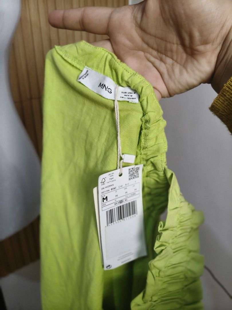 Mango Lime Green Ruffled Strap Tank Top (Category: Sleeveless) located in Taguig. Submitted by ashie_clothing (Listing ID 1470318487, Image 3). Description: Lime green tank top from Mango. Square neckline with gathered fabric. Wide, ruffled straps. Relaxed fit, super easy to throw on with jeans or shorts. Brand new with tags attached still. Size M..