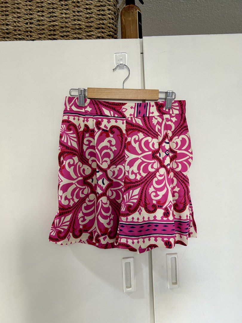 Mango Mango Pink Patterned Shorts Size S (Category: Shorts) located in Manila. Submitted by isabelle_1104 (Listing ID 1470277522, Image 1). Description: - Brand: MNG - Pattern & Colors: Bright pink, red, and cream - Size: EUR-USA S / MEX CH - Design: Elastic waistband at the back with a smooth front panel and pleated details - Material: Lightweight fabric - Origin: Made in Morocco - Condition: Great vibrant piece for warm weather.
