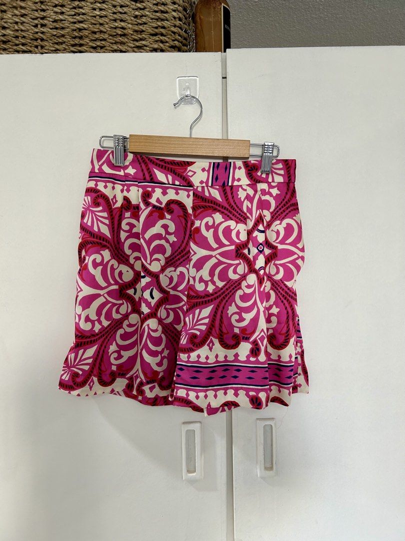 Mango Mango Pink Patterned Shorts Size S (Category: Shorts) located in Manila. Submitted by isabelle_1104 (Listing ID 1470277522, Image 2). Description: - Brand: MNG - Pattern & Colors: Bright pink, red, and cream - Size: EUR-USA S / MEX CH - Design: Elastic waistband at the back with a smooth front panel and pleated details - Material: Lightweight fabric - Origin: Made in Morocco - Condition: Great vibrant piece for warm weather.