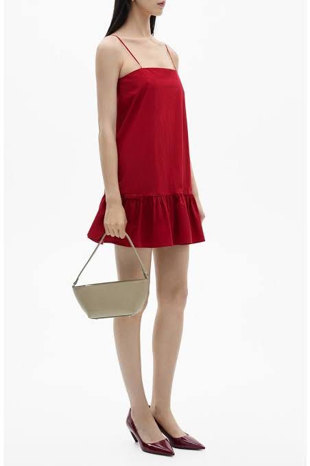 Mango Red spaghetti strap mini dress with ruffled hem (Category: Dresses) located in Cebu City. Submitted by uniquepreloved88 (Listing ID 1470312768, Image 3). Description: Vibrant red mini dress with thin spaghetti straps and a straight neckline. Dropped waistline featuring a ruffled hem tier. Lightweight fabric, hits above the knee. Clean solid red color throughout. Simple slip-on style with structured fit. Great piece for warm weather or casua