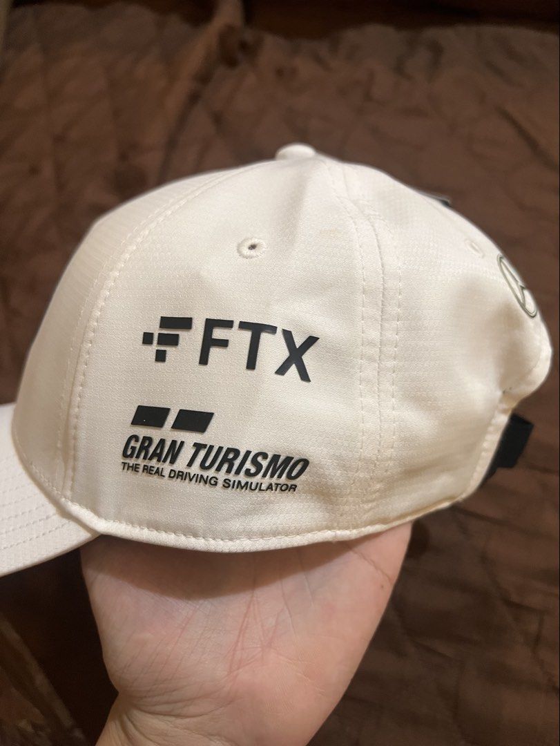 MAPF1 RP LEWIS HAMILTON DRIVER BASEBALL CAP (Category: Caps & Hats) located in Manila. Submitted by bebotdepop (Listing ID 1470263985, Image 3). Description: - Brand new with original stitch tags attached - Official Mercedes AMG Petronas F1 Team Lewis Hamilton Driver Edition cap - Clean white colorway featuring FTX and Gran Turismo side logos - Adjustable black strap with secure buckle closure - One Size Fits All (OSFA) Unused, kept inside plasti