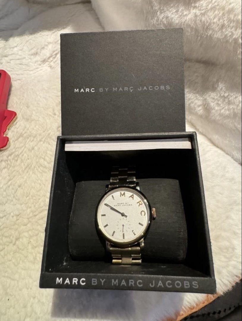 Marc by Marc Jacobs Watch (Category: Women's Watches) located in Valenzuela. Submitted by wisetree_18aeb6 (Listing ID 1470190123, Image 2). Description: - Brand: Marc by Marc Jacobs - Design: Gold tone metal bracelet with a clean white dial and unique gold-tone 'MARC' lettering on the bezel - Features: Functional sub-dial at the bottom - Inclusion: Comes with original black presentation box - Condition: Well-maintained and 100% authentic - Shippi