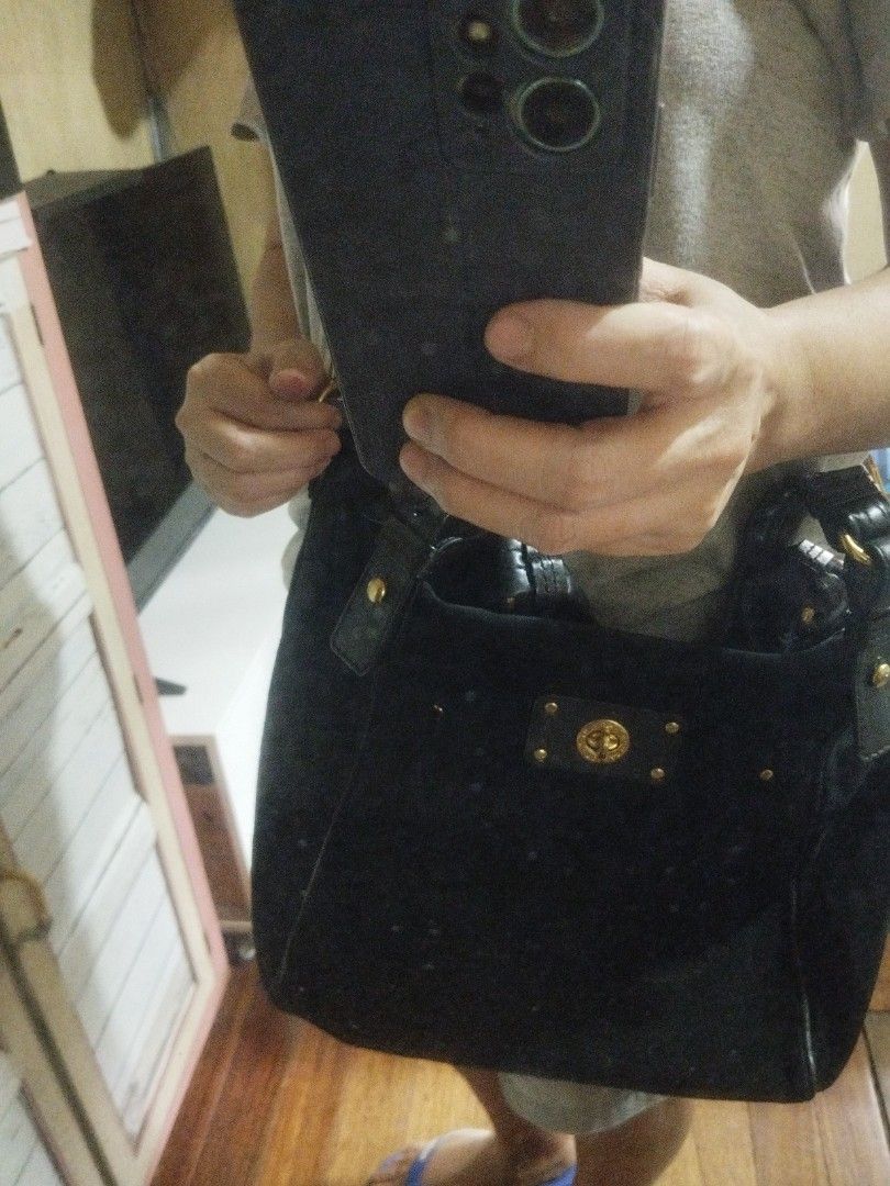 Marc Jacobs Black Suede Shoulder Bag With Removable Strap (Category: Cross-body Bags) located in Manila. Submitted by lene48 (Listing ID 1470283118, Image 3). Description: - Color & Material: Black suede with soft texture - Hardware: Elegant gold-tone accents - Exterior: Signature plaque on front pocket - Straps: Dual top handles and a detachable leather crossbody strap - Interior: Roomy and spacious for everyday essentials - Style: Versatile des