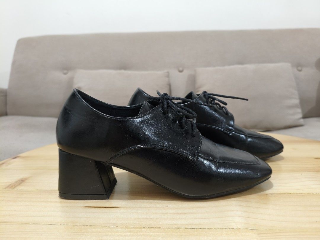 Mario D' Boro Women's Pumps (Category: Heels) located in Quezon City. Submitted by petie_ph (Listing ID 1470146946, Image 2). Description: - Brand: Mario D'boro - Color: Classic Black - Style: Lace-up heels with chunky block heel and square toe - Finish: Glossy material - Condition: Clean soles and heels, minimal signs of handling - Ideal for: Workwear, office attire, and formal events.