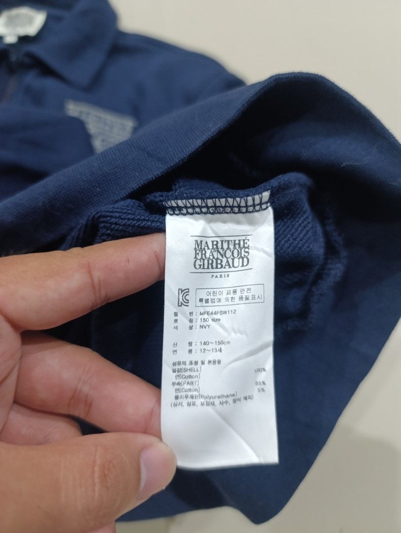 Marithe Francois Girbaud Enfant Navy Zip Sweatshirt (Category: Coats, Jackets and Outerwear) located in Davao. Submitted by idioticthrifter (Listing ID 1470330261, Image 3). Description: - Brand: Marithé François Girbaud - Style: Quarter zip sweatshirt with collared neck - Color: Navy Blue - Size: 18 width x 22 length - Material: 100% cotton shell - Features: Embroidered logo on left chest, ribbed cuffs and hem - Condition: Clean piece overall, e