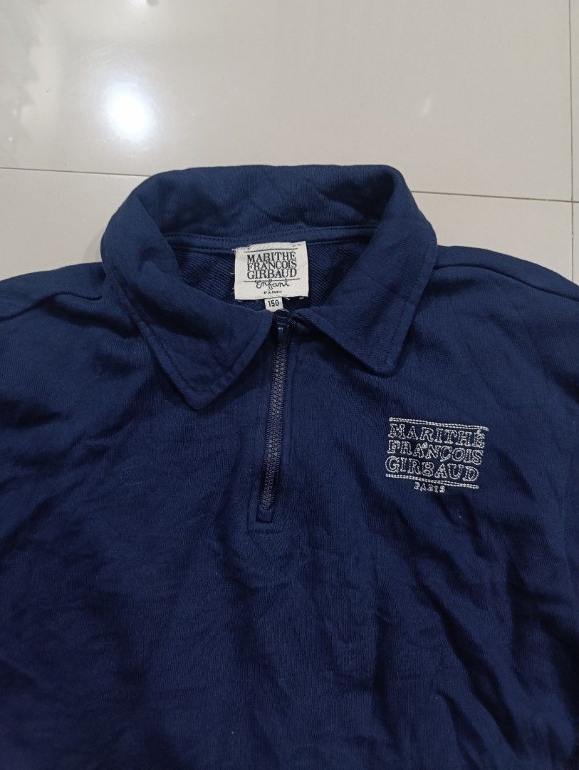 Marithe Francois Girbaud Enfant Navy Zip Sweatshirt (Category: Coats, Jackets and Outerwear) located in Davao. Submitted by idioticthrifter (Listing ID 1470330261, Image 2). Description: - Brand: Marithé François Girbaud - Style: Quarter zip sweatshirt with collared neck - Color: Navy Blue - Size: 18 width x 22 length - Material: 100% cotton shell - Features: Embroidered logo on left chest, ribbed cuffs and hem - Condition: Clean piece overall, e