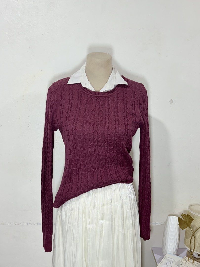 Maroon cable knit sweater with white inner collar (Category: Coats, Jackets and Outerwear) located in Manila. Submitted by biacakes (Listing ID 1470263215, Image 2). Description: - Color: Maroon with white layered collar - Material: Comfortable cable knit fabric - Design: Long sleeves with textured pattern throughout - Fit: Best fits up to Medium frame - Style: Preppy, great for chilly weather and casual layering.