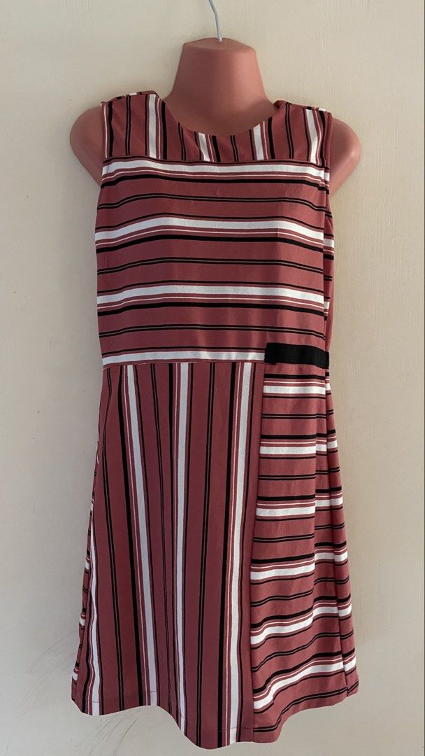 Maroon Striped Sleeveless Dress (Category: Dresses) located in Lucena. Submitted by lazyqueen29 (Listing ID 1470210819, Image 2). Description: ✨ Maroon, black, and white striped pattern ✨ Sleeveless design ✨ A-line skirt ✨ With black accent detail at the waist ✨ Comfortable and easy to style ✨ Perfect for casual outings, dates, and everyday wear.