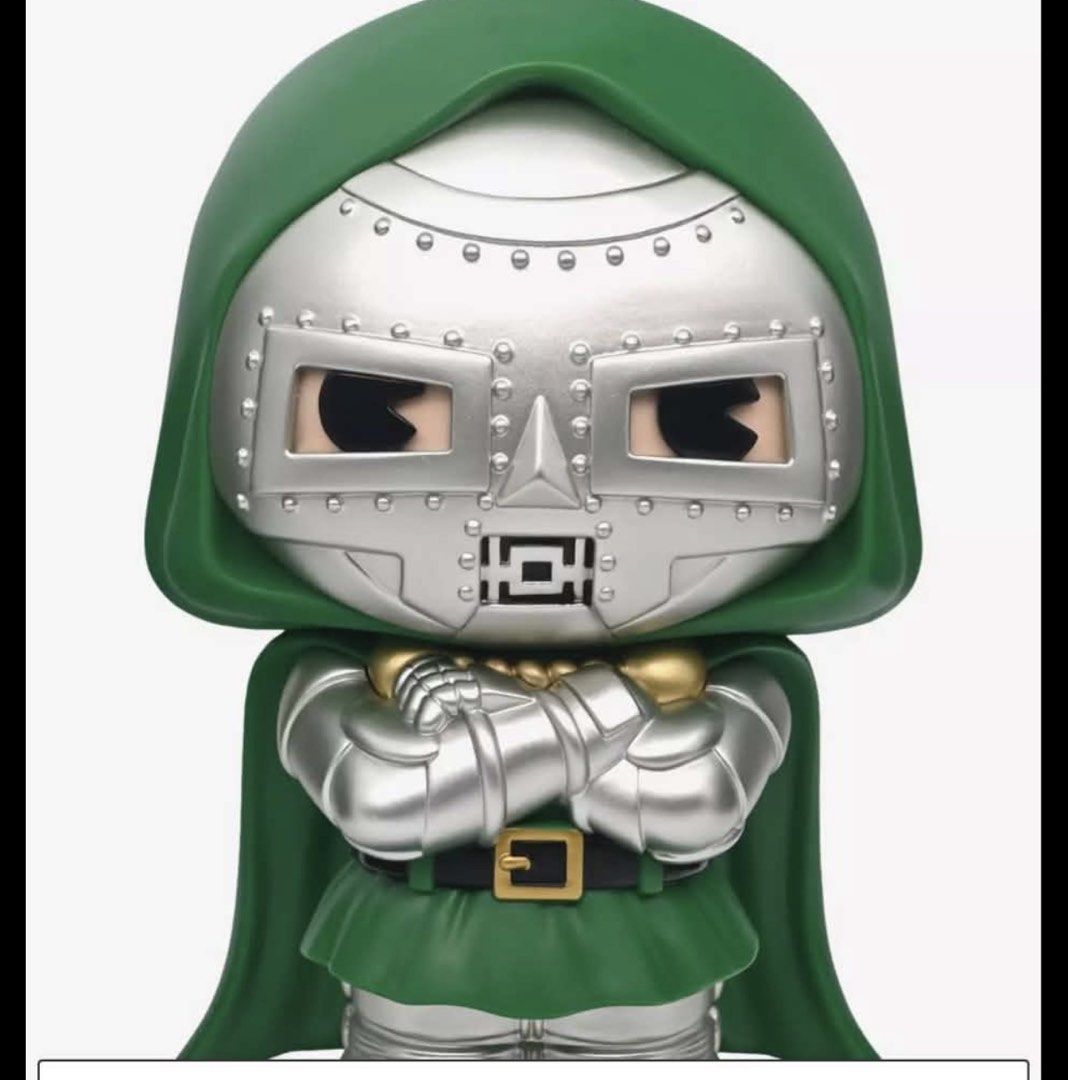Marvel Doctor Doom Coin Box (Category: Designer & Blind Box Toys) located in Pasig City. Submitted by preloved_items_roche (Listing ID 1470338778, Image 1). Description: - Character: Doctor Doom from Marvel Comics - Design: Classic green hood, cape, and detailed metallic silver armor - Condition: Loose figure (box not included) - Ideal for: Collectors, desk display, or shelf decor.