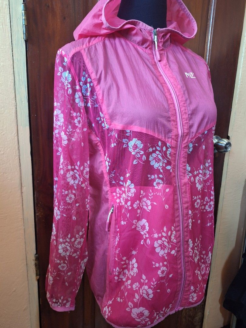 Y2K 2000s style Marzo Floral Pink Windbreaker Jacket Size 100 (Category: Coats, Jackets and Outerwear) located in Balamban. Submitted by ubethan (Listing ID 1470212329, Image 3). Description: - Brand: Marzo - Size: 100 - Color/Design: Pink with stylish white floral pattern on the back and sleeves, solid pink front chest panel and hood - Material: Lightweight mesh with transparent sections - Features: Full zip closure and secure zipped side pocket