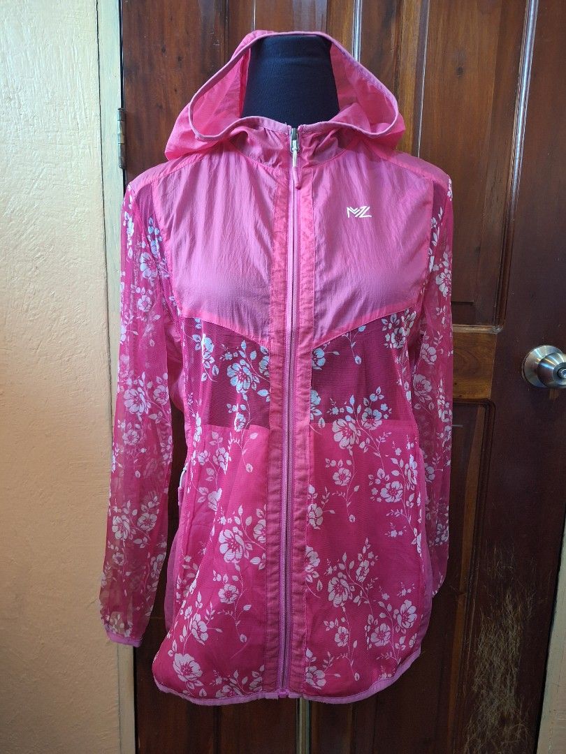 Y2K 2000s style Marzo Floral Pink Windbreaker Jacket Size 100 (Category: Coats, Jackets and Outerwear) located in Balamban. Submitted by ubethan (Listing ID 1470212329, Image 1). Description: - Brand: Marzo - Size: 100 - Color/Design: Pink with stylish white floral pattern on the back and sleeves, solid pink front chest panel and hood - Material: Lightweight mesh with transparent sections - Features: Full zip closure and secure zipped side pocket