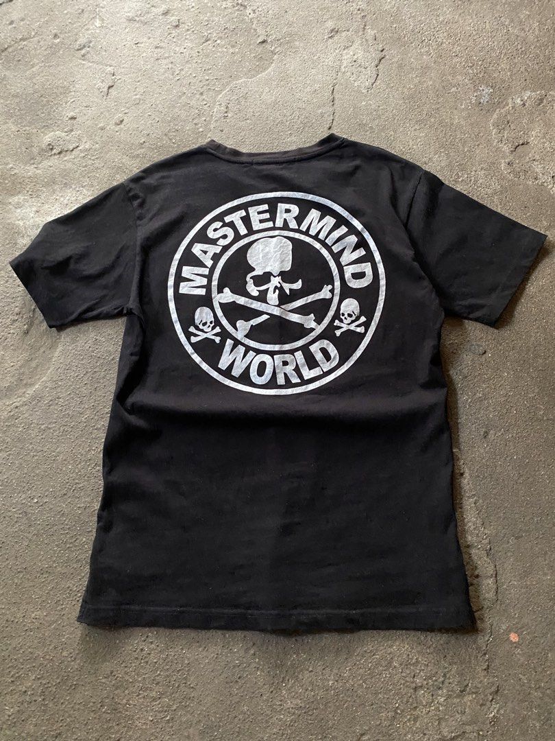 Mastermind World Black T-Shirt with Back Logo (Category: Tshirts & Polo Shirts ) located in Caloocan City. Submitted by remythrift (Listing ID 1470187400, Image 2). Description: - Brand: Mastermind World - Color: Classic Black - Fit: Regular fit crew neck - Back Design: Large silver circular logo with iconic skull and crossbones - Front Detail: Bold mastermind branding flanked by skulls on the front hem - Finishing Touches: Small woven skull labe